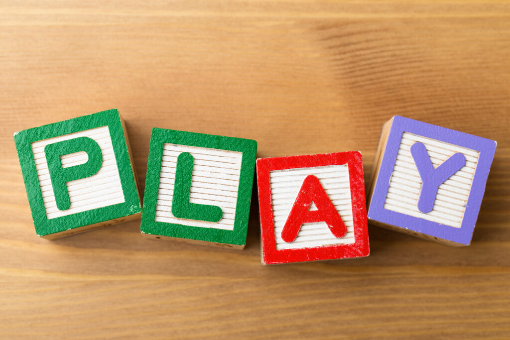 Wooden alphabet blocks spelling the word, play